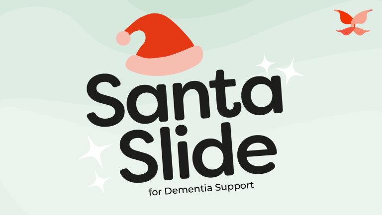 Santa Slide for Dementia Support written on a Blue Background with an Orange Santa Hat